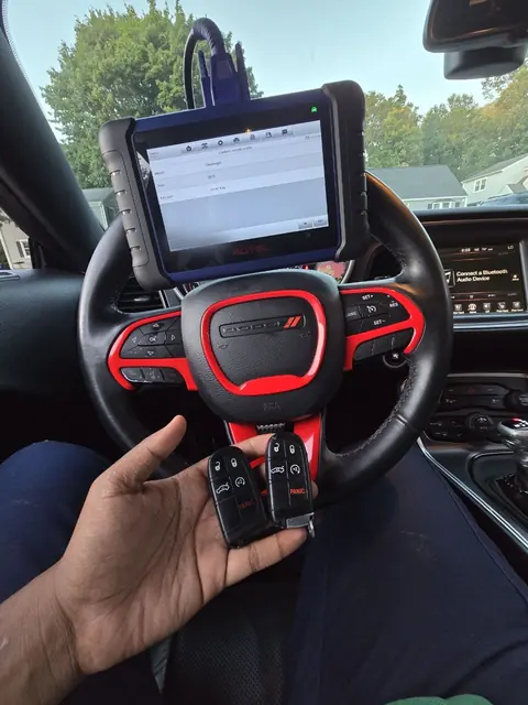 Scan tool on a Dodge Challenger steering wheel with two new smart keys